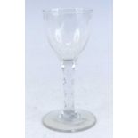 A wine glass, circa 1785, the round funnel bowl above a faceted stem, h.15cm