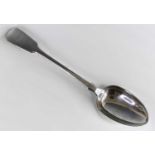 A Victorian silver serving spoon, in the Fiddle pattern, bearing bright cut engraved heraldic