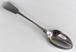 A Victorian silver serving spoon, in the Fiddle pattern, bearing bright cut engraved heraldic