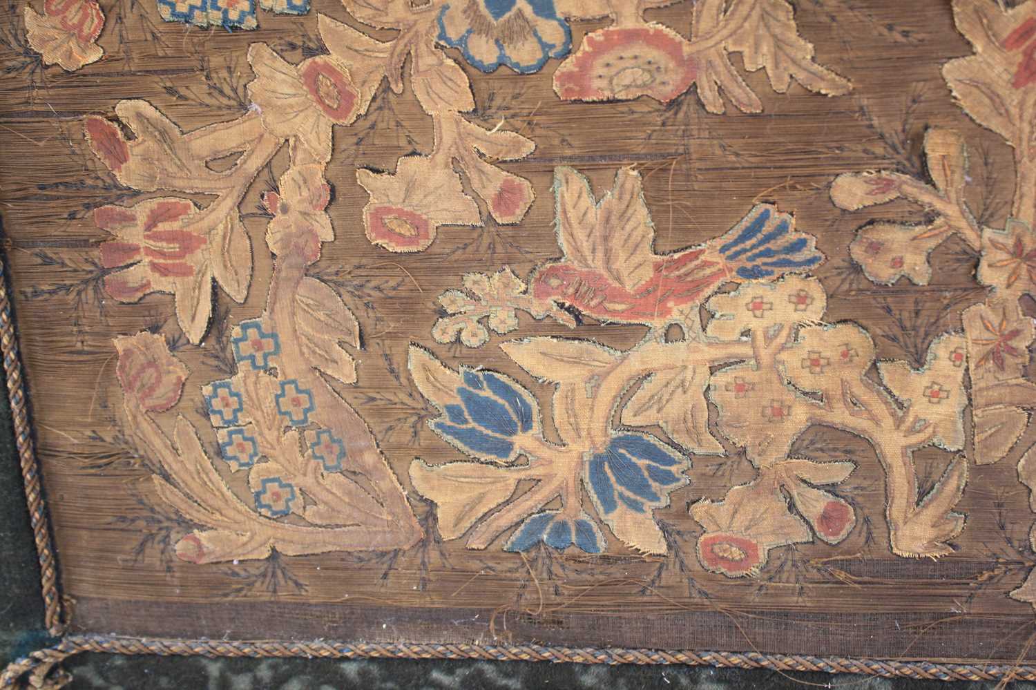 A 17th century silkwork appliqué panel, having tent-stitched silkwork birds upon flowering - Image 9 of 9