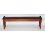 A Victorian style mahogany window seat, of good size, having scroll ends and on ring turned tapering