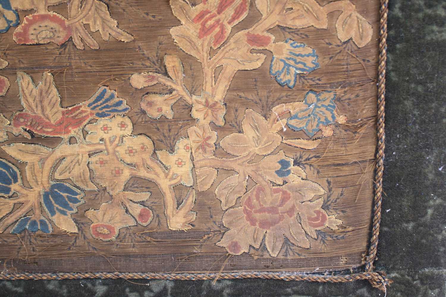 A 17th century silkwork appliqué panel, having tent-stitched silkwork birds upon flowering - Image 8 of 9