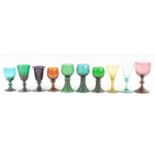 A collection of coloured drinking glasses, 19th century and later, to include sea green, amethyst