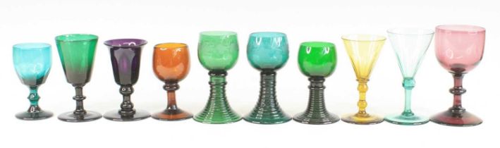 A collection of coloured drinking glasses, 19th century and later, to include sea green, amethyst