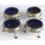 A set of four Victorian silver table salts, of cauldron form with reeded everted rims, the bodies