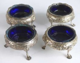 A set of four Victorian silver table salts, of cauldron form with reeded everted rims, the bodies