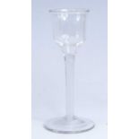 A wine glass, circa 1770, the lipped ogee bowl above a multi series opaque twist stem, h.15.5cm