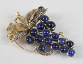 A yellow metal Art Nouveau style sapphire and diamond brooch in the form of a bunch of grapes,