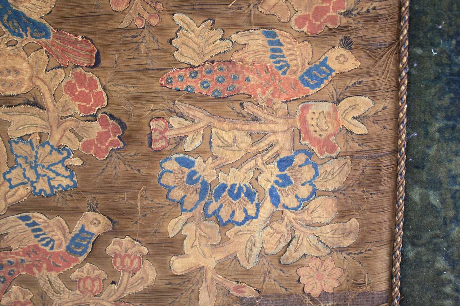 A 17th century silkwork appliqué panel, having tent-stitched silkwork birds upon flowering - Image 4 of 9