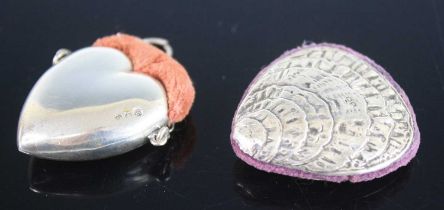 An early 20th century silver novelty pin cushion in the form of a closed clamshell, naturalistically