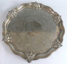 A large early Victorian silver salver, of shaped circular form with raised reeded and contoured rim,