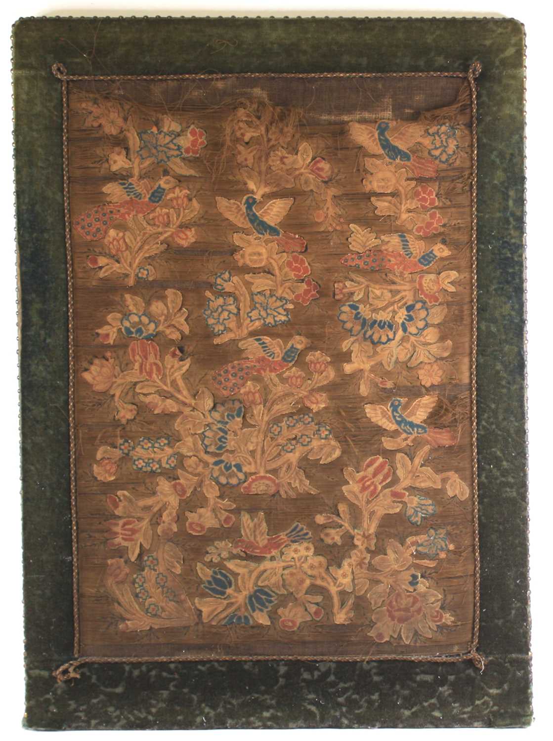 A 17th century silkwork appliqué panel, having tent-stitched silkwork birds upon flowering