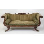 A Regency mahogany framed double scroll end settee, having swept back and arms, the whole