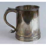A Georgian style silver tankard, of flaring conical form to a reeded footrim, inscribed Hannover
