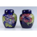 A Moorcroft Hibiscus pattern pottery ginger jar and cover, underglaze painted and tube line