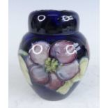 A mid 20th century Moorcroft Anemone pattern small pottery ginger jar and cover of slightly