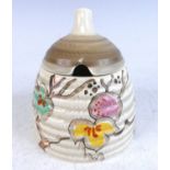 A 1930s Clarice Cliff honey pot and cover, floral bright colour stylised decorated, with blue