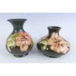 A Moorcroft pottery lower baluster form vase in the Hibiscus pattern, underglaze painted and tube-