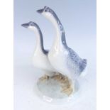 A Royal Copenhagen porcelain model of a pair of geese designed by Peter Herold, printed backstamp