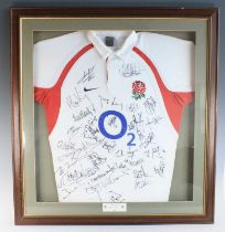 A replica England Rugby shirt, bearing the signatures in black ink of the 2003 World Cup squad,