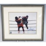 Boxing, Joe Frazier, a 20 x 25cm colour photograph of Frazier in the ring, signed lower right,
