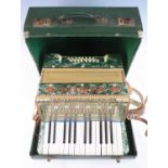 An early 20th century Italian Estrella twenty-four button piano accordion, cased.