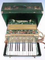 An early 20th century Italian Estrella twenty-four button piano accordion, cased.