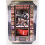 Frank Bruno, a Title red leather boxing glove signed "Best Wishes Frank Bruno", mounted beneath an