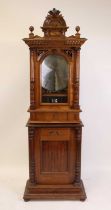 A late 19th century walnut cased coin opereated Polyhon music player in the manner of Nicole