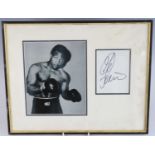 Boxing, George Foreman, signed album page mounted next to a 22 x 18cm black and white photograph,