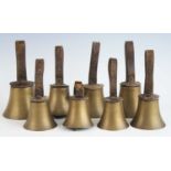 Campanology, a set of eight musical hand bells, each with a leather collar and handle stamped with
