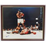 Muhammad Ali (1942-2016) and Sonny Liston (1930-1970), a coloured print showing Ali knocking out