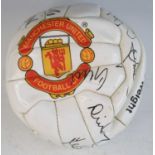 An Official Manchester United Football Club leather football, signed in black ink by various team