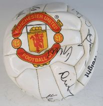 An Official Manchester United Football Club leather football, signed in black ink by various team