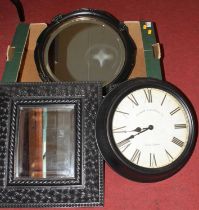 A modern wall clock, together with two black painted wall mirrors