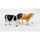 A Beswick model of a Guernsey cow, model 1248B, height 11cm, together with another similar