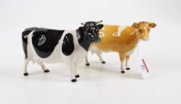 A Beswick model of a Guernsey cow, model 1248B, height 11cm, together with another similar