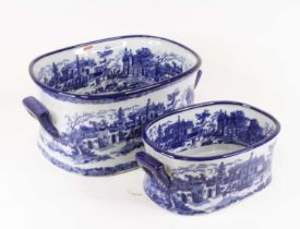 A graduated set of two Victorian style blue and white transfer decorated foot-baths, the largest w.
