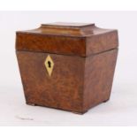 A George III burr walnut tea caddy of sarcophagus form, having a kite shaped ivory escutcheon, the