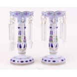 A pair of Victorian blue and white overlaid glass table lustres, each height 26cm One has a chip
