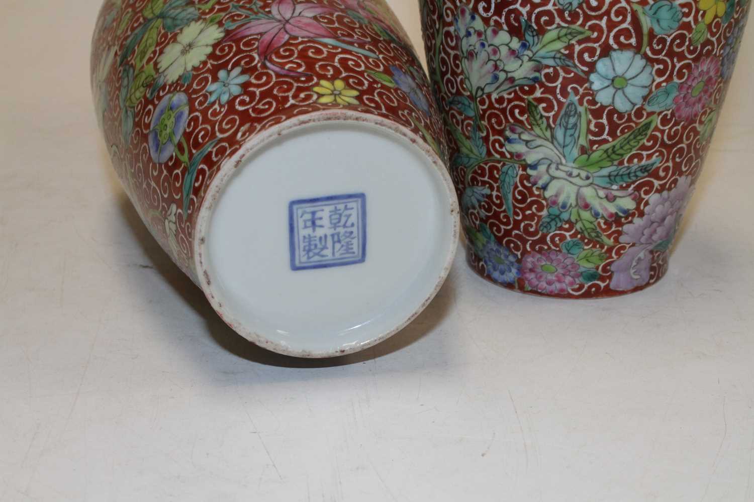 A pair of Chinese porcelain vases, each enamel decorated with flowers, four character seal mark to - Image 4 of 5