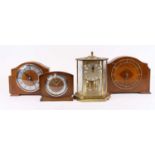 An early 20th century walnut cased mantel clock, height 21.5cm together with three others similar