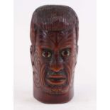 A New Zealand Maori carved hardwood portrait head, having mother of pearl inlaid eyes, height 27cm