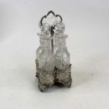 A Victorian silver and cut glass bottle cruet, the weighted silver stand of pierced quatrefoil