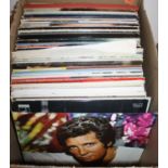 A collection of vintage LPs to include Tom Jones, Peters & Lee, and Nat King Cole