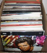 A collection of vintage LPs to include Tom Jones, Peters & Lee, and Nat King Cole