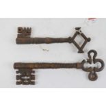 Two large cast iron keys, the largest length 28cm