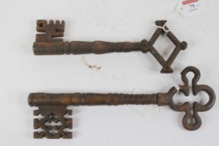 Two large cast iron keys, the largest length 28cm