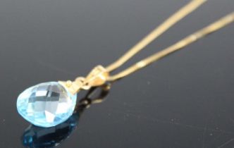 A 9ct yellow gold blue topaz pendant, featuring a briolette cut blue topaz, dimensions approx 16.