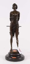 A bronzed figure of a lady, shown holding a staff, upon a black polished hardstone plinth, h.36cm